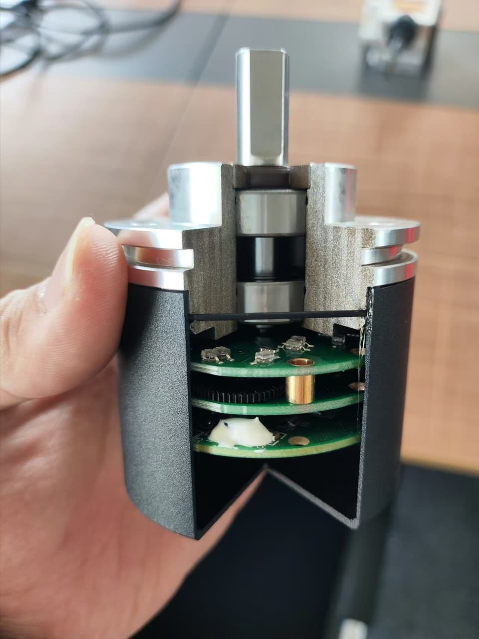 Inside a multi-turn absolute encoder — gear train and PCB stack